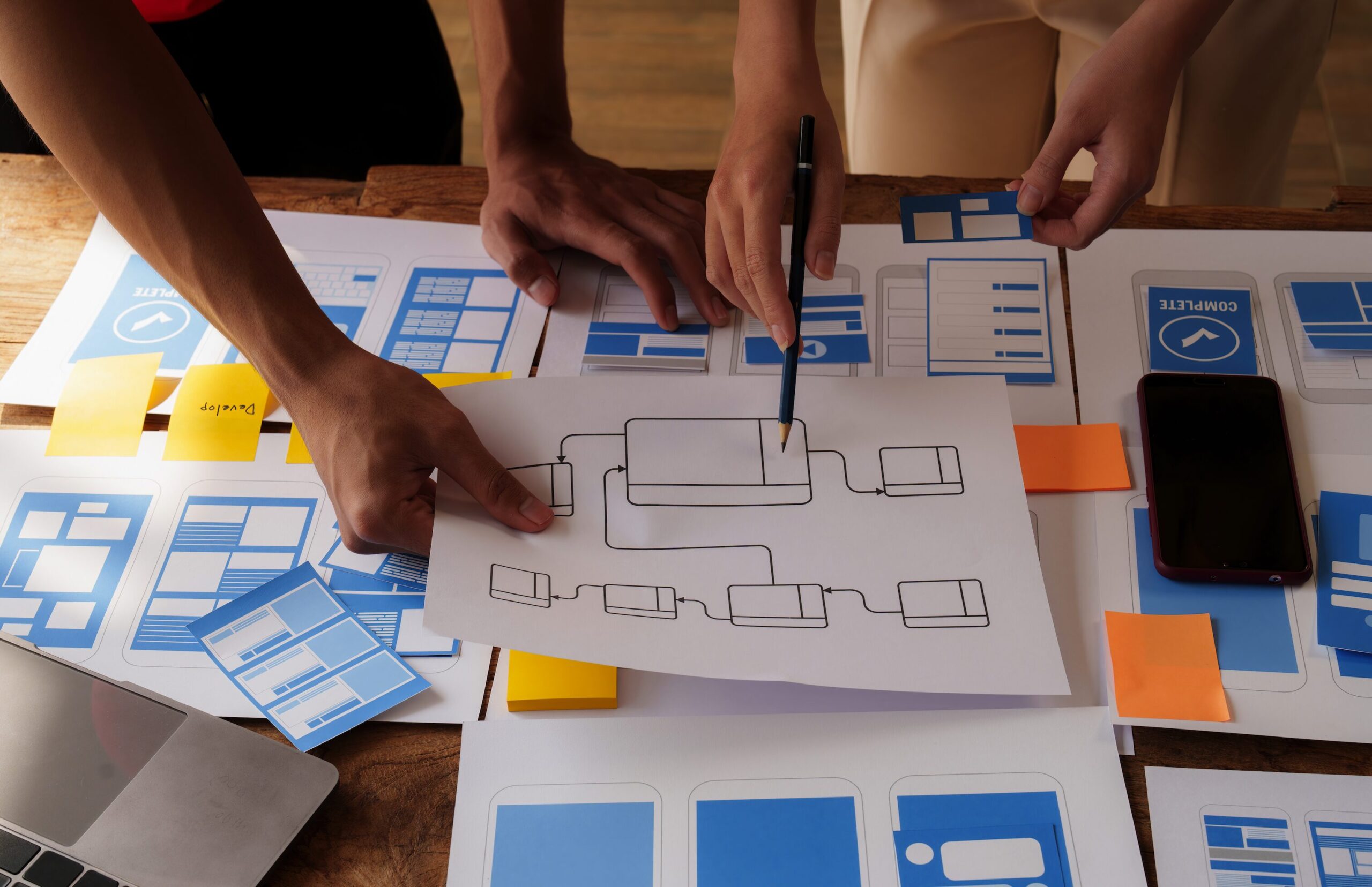 Table showing network design with people arount it.